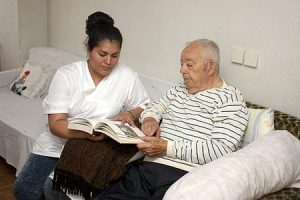 lady caring for elderly gentleman
